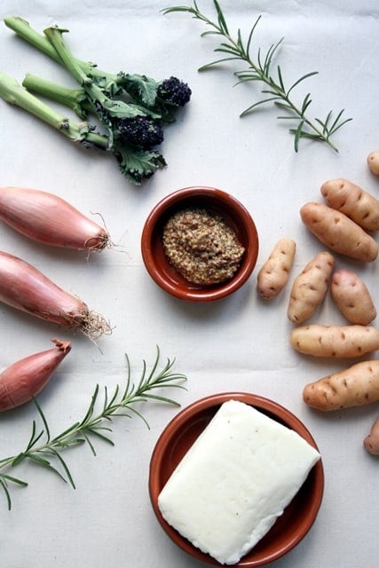 An array of ingredients for roasted shallot and potato salad.