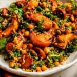 Roast pumpkin quinoa salad with chorizo in a bowl with a fork.