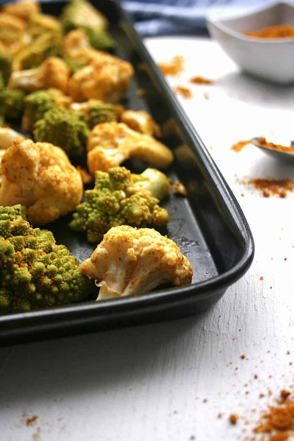 A tray of cauliflower coated in spices.