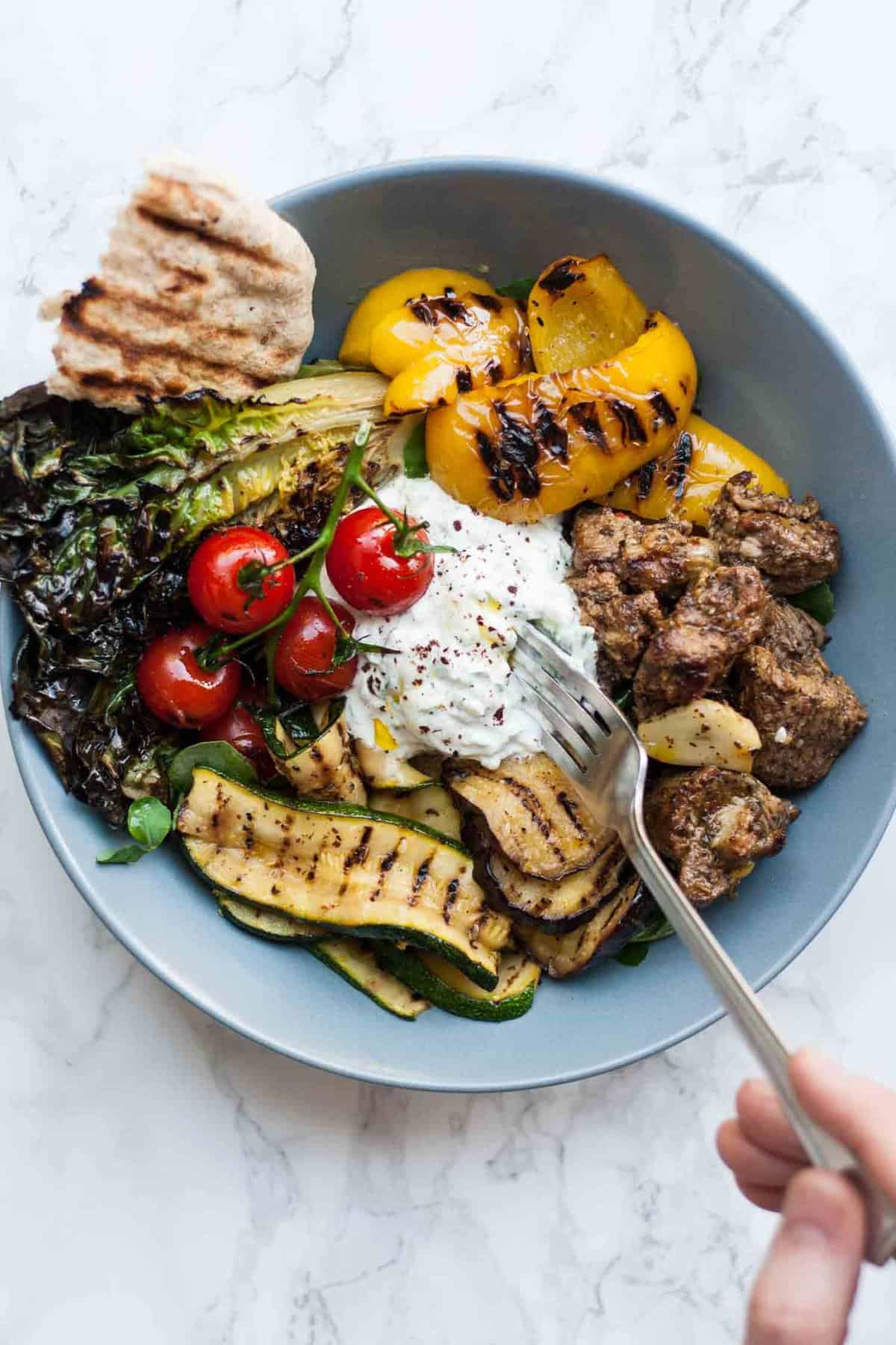 Lamb Souvlaki with Sumac Tzatziki - this simple grilled lamb dish is full of chargrilled flavour, perfect for eating in the garden on summer evenings. | eatloveeats.com