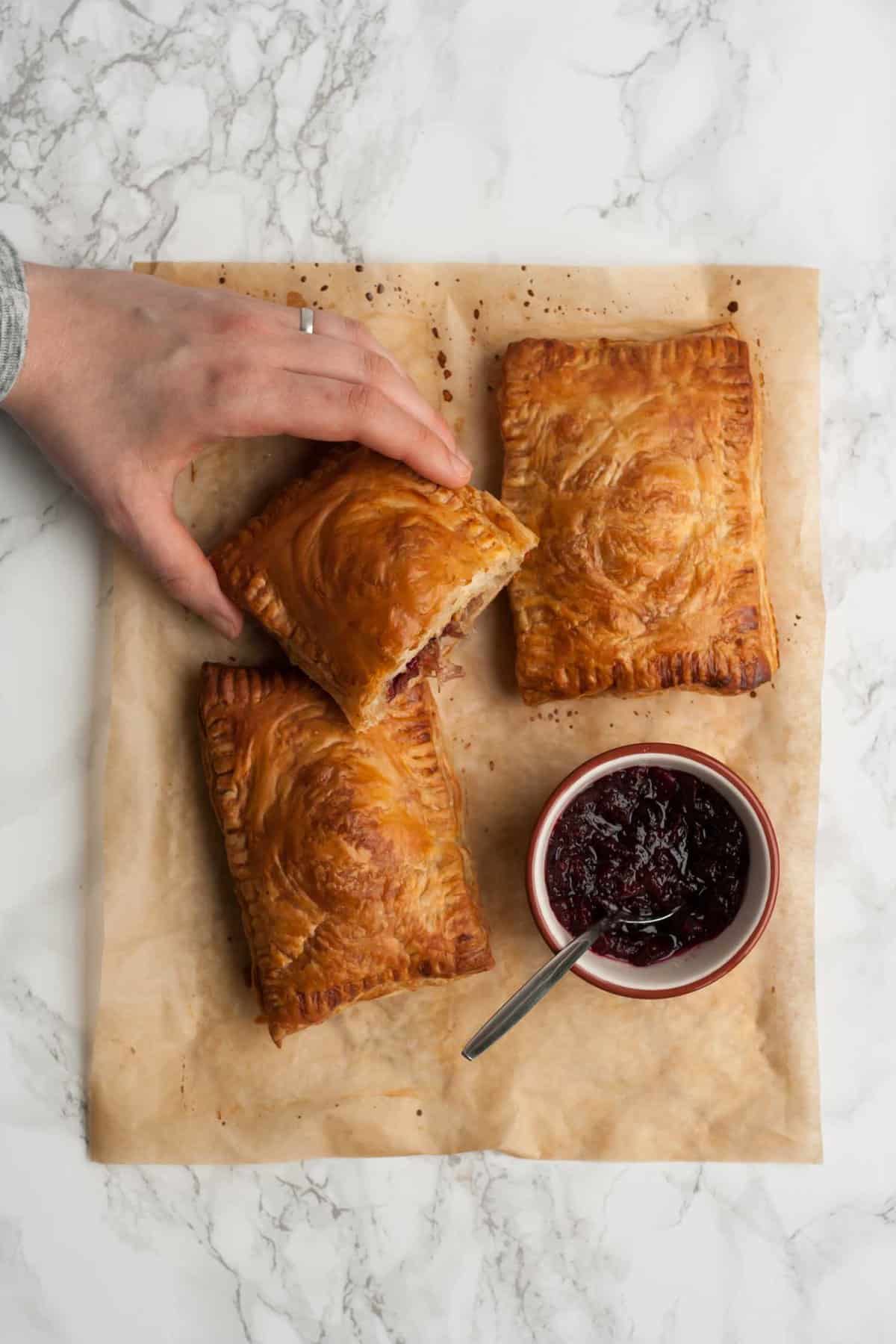 An overhead shot with someone holding a pastry.