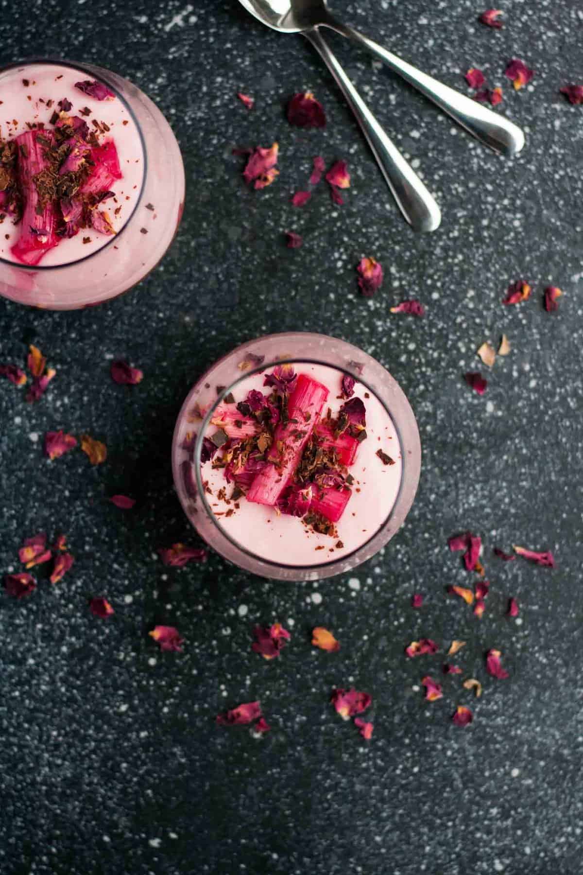 An overhead of the rhubarb sitting on top of the rhubarb parfait in a glass.