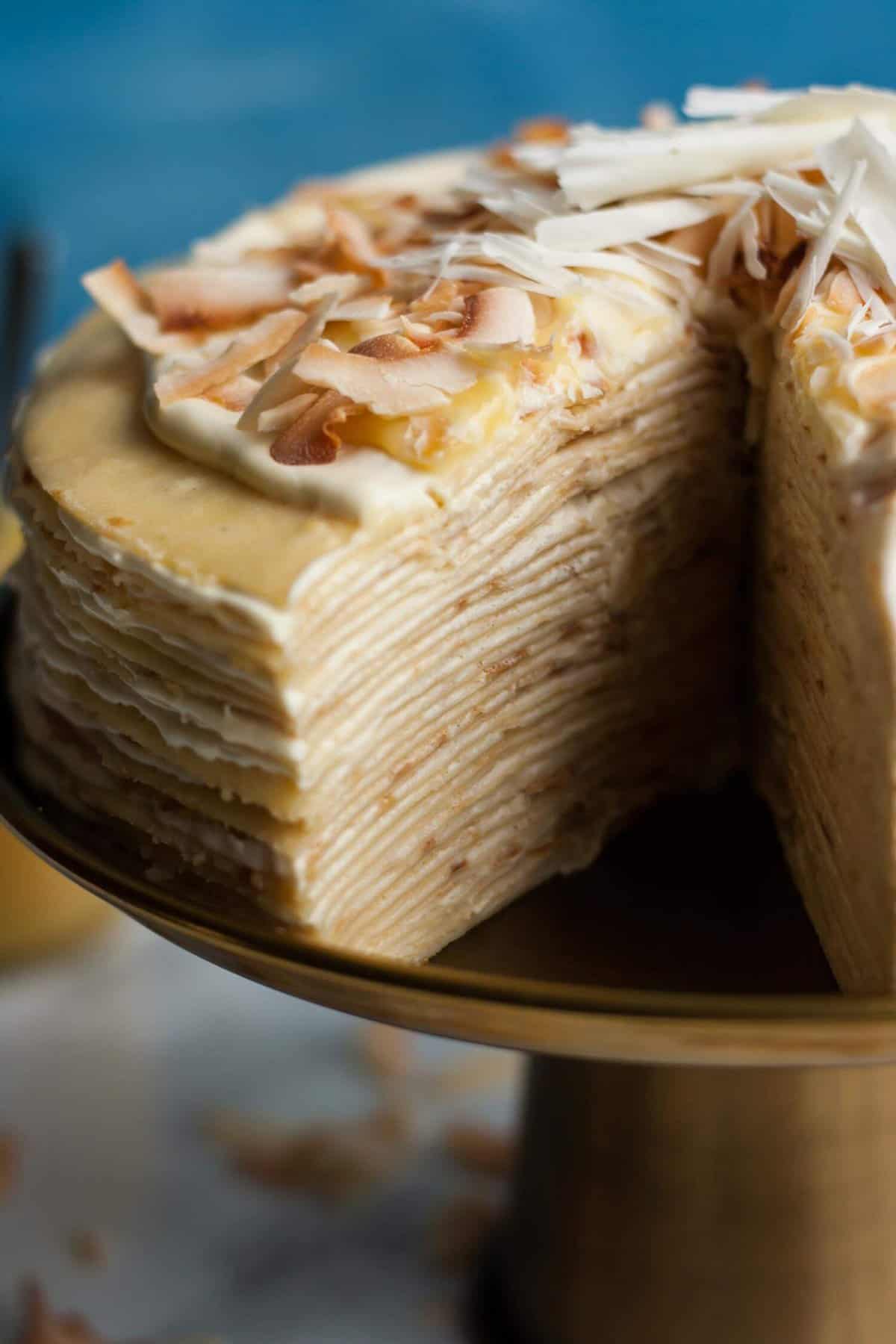 A close up showing the inside of the cut out section of crepe cake.
