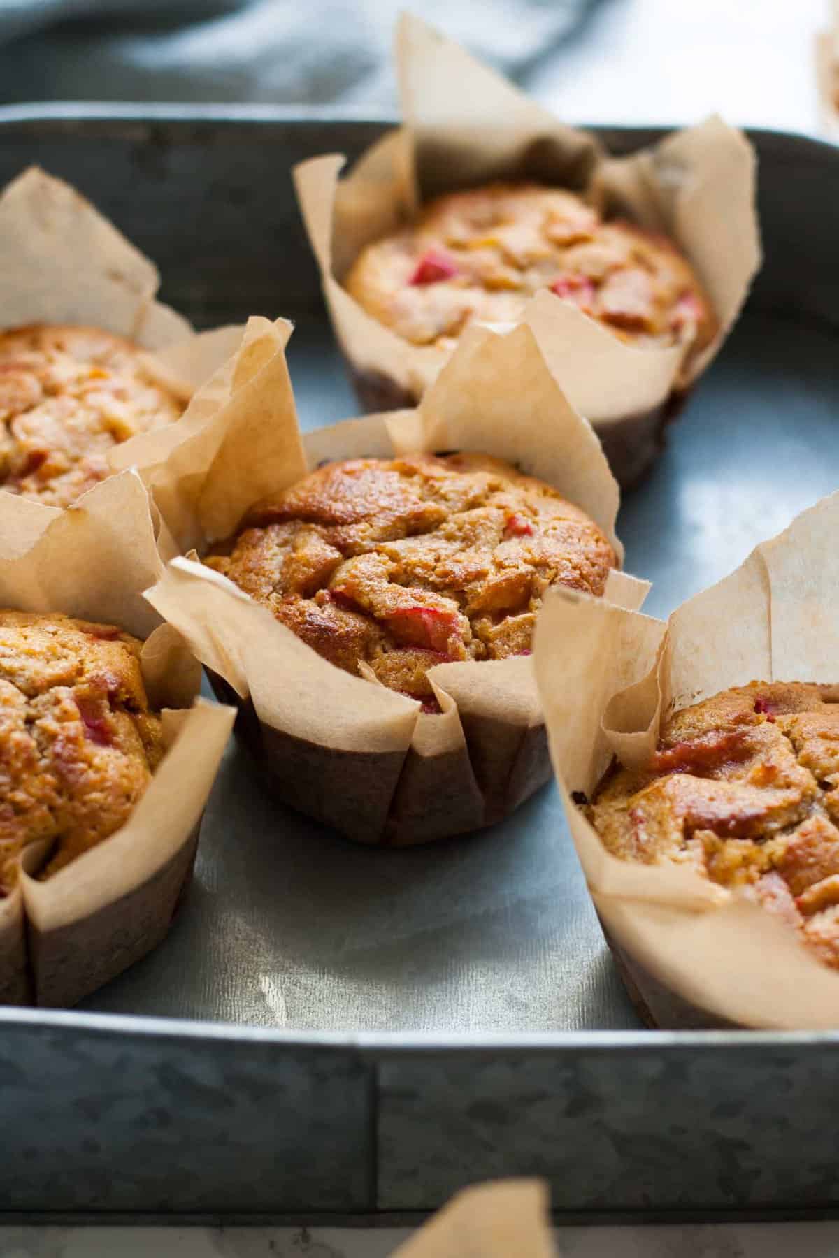 An array of baked muffins in their liners.