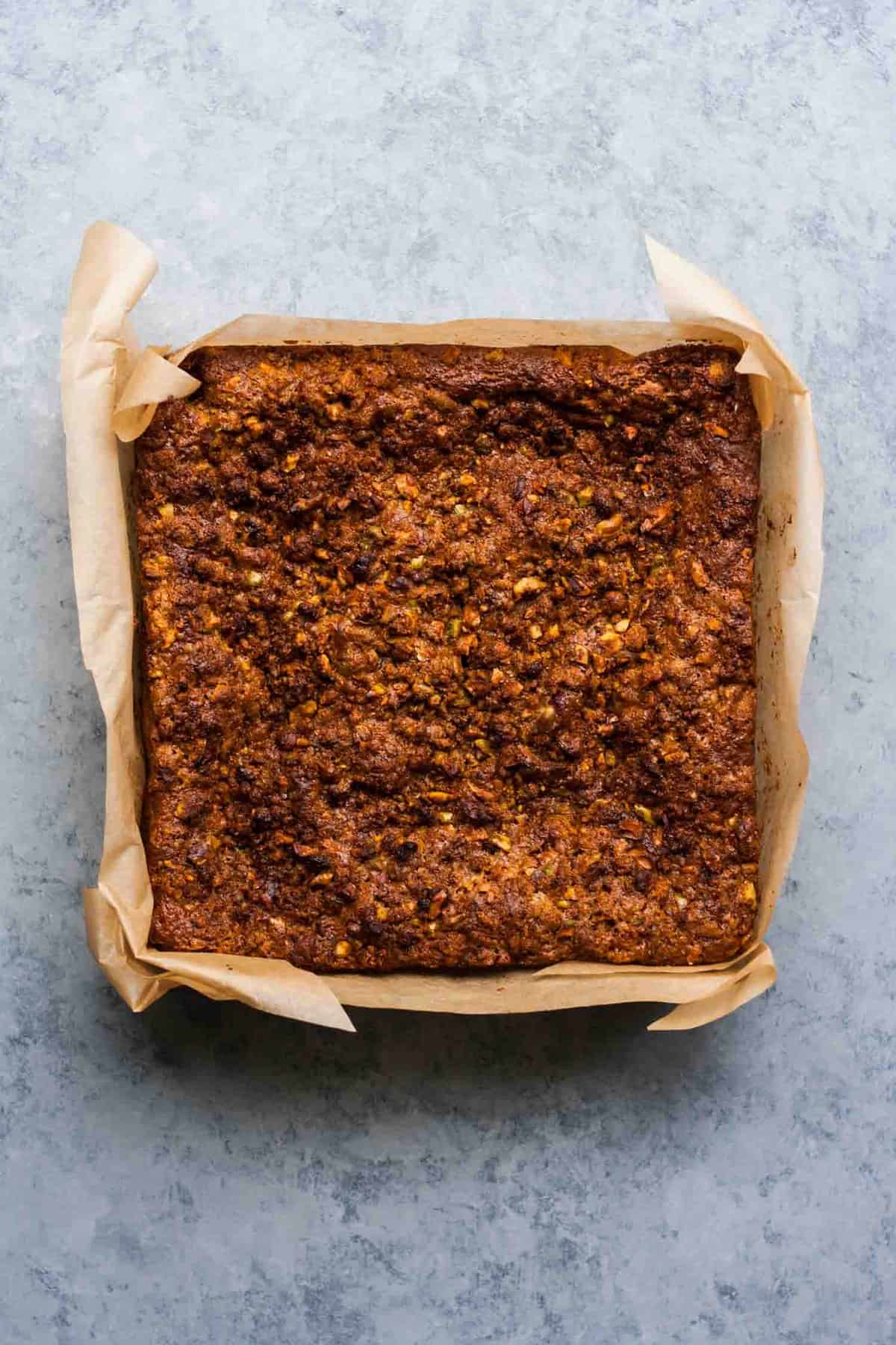 rhubarb yoghurt cake baked in a tin lined with parchment paper.