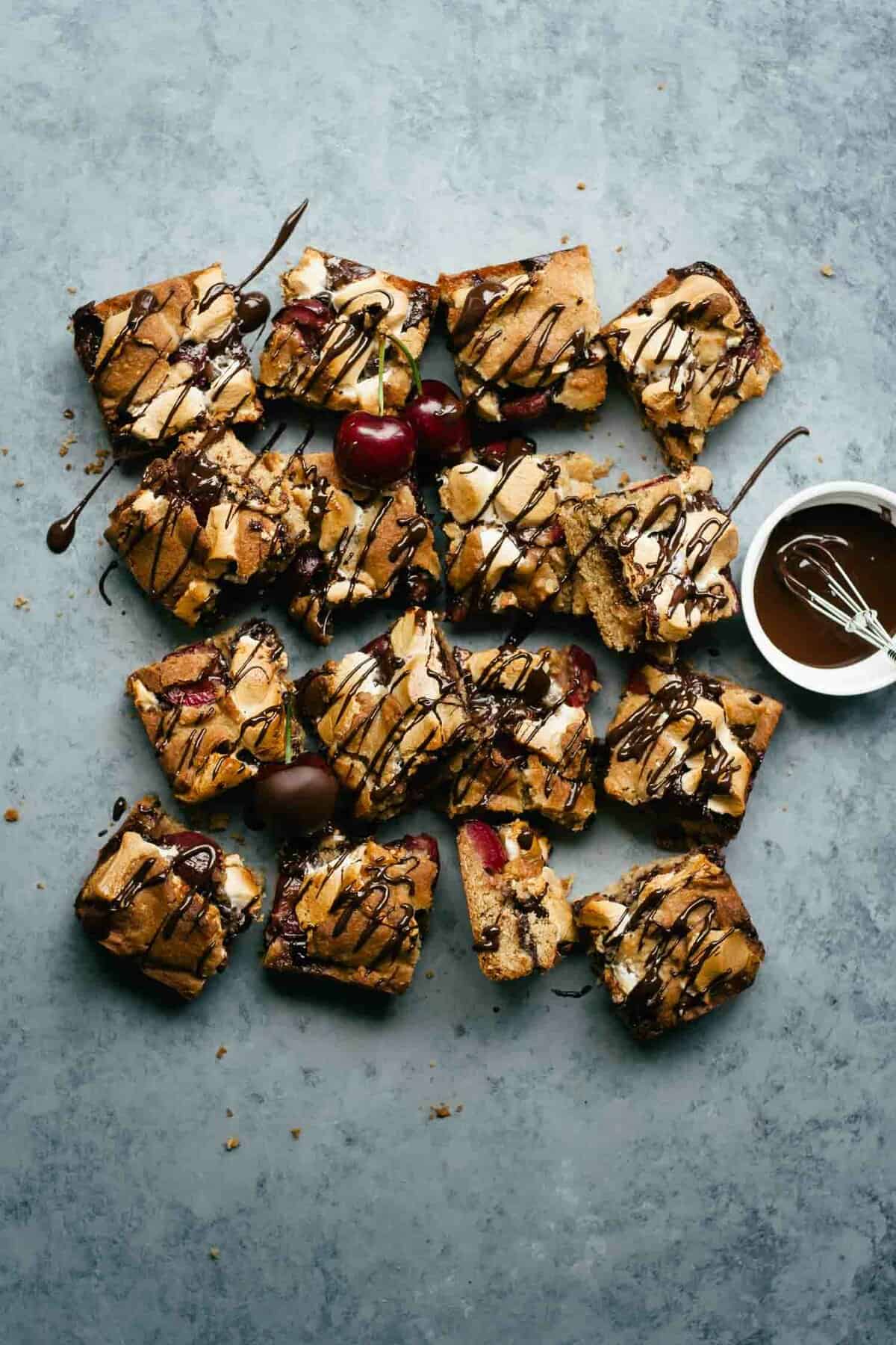 Chocolate s\'mores being drizzled with melted chocolate sauce. 