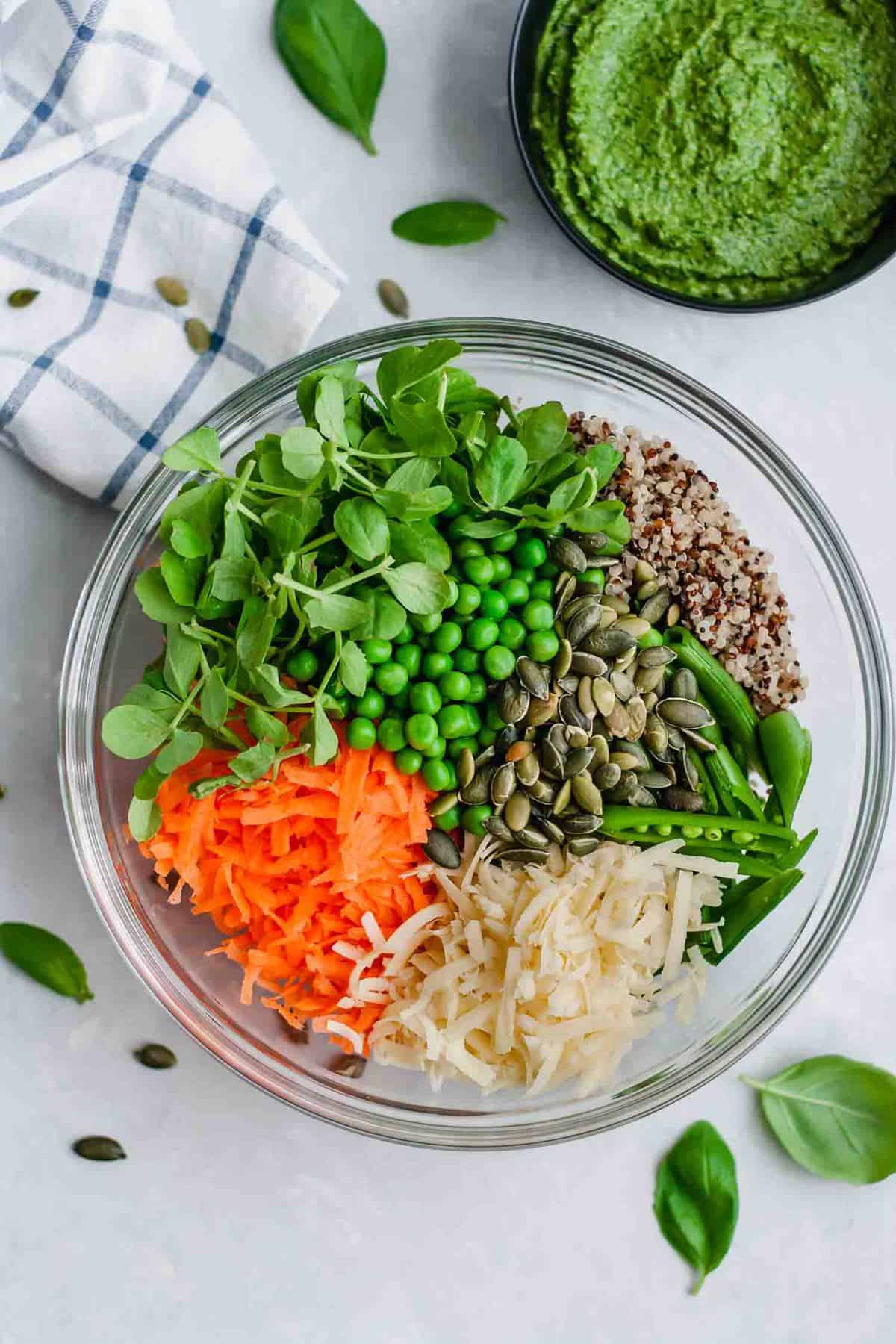 A bowl of the ingredients for the quinoa salad before mixing. 