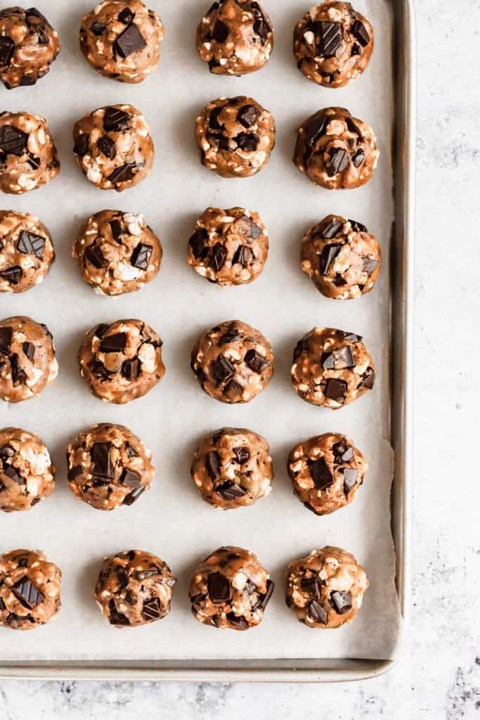 a tray of unbaked balls of cookie dough