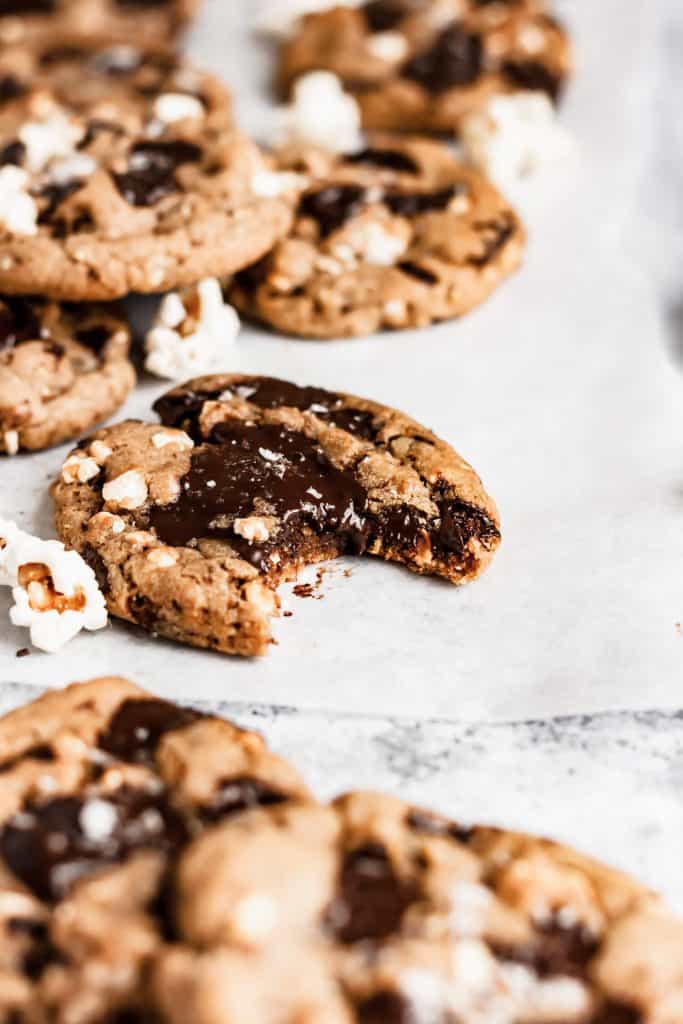 a popcorn chocolate chip cookie with a bite taken out of it