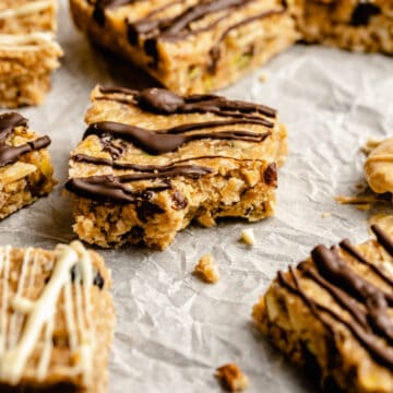 cashew butter granola bars on a piece of crumpled up parchment paper