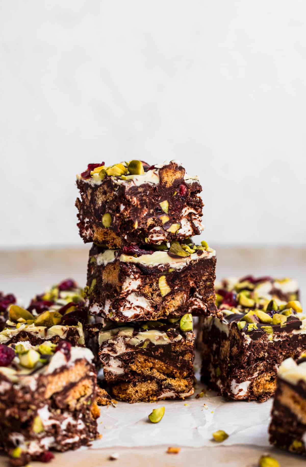 A stack of Christmas rocky road cut up into squares showing all the tasty insides. 