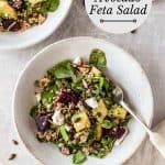 Beetroot avocado feta salad in a bowl with a spoon