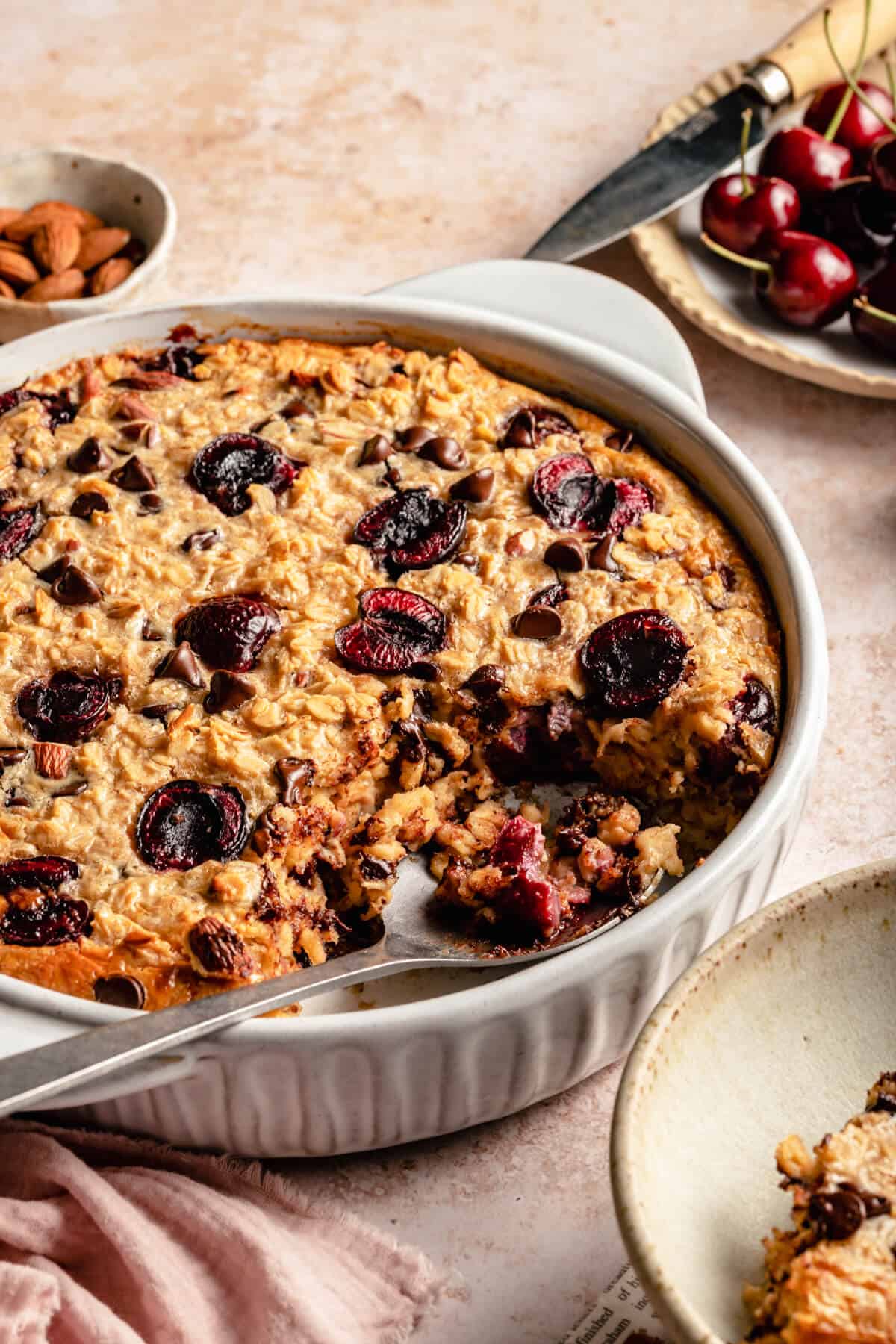 close up of the inside of the baked oatmeal with a serving spoon