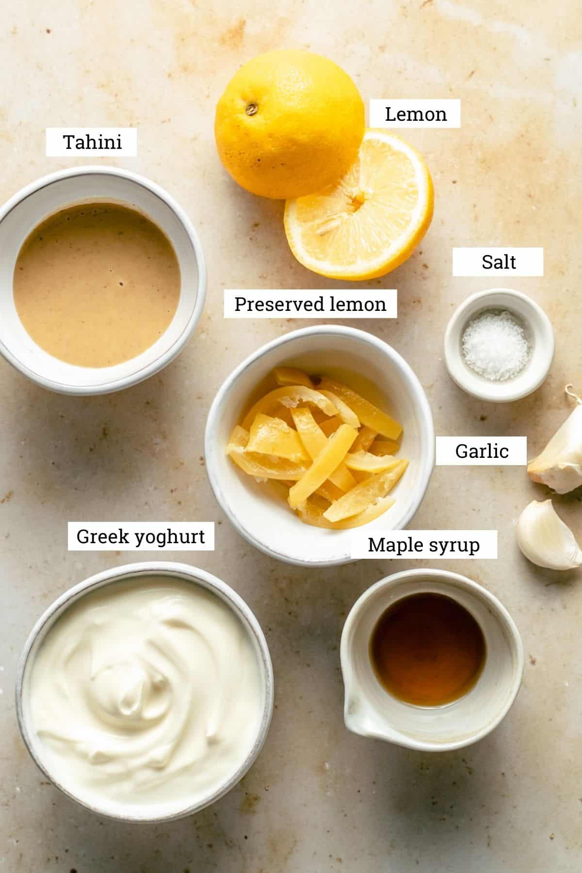 Lemon and garlic yoghurt dressing in bowls.
