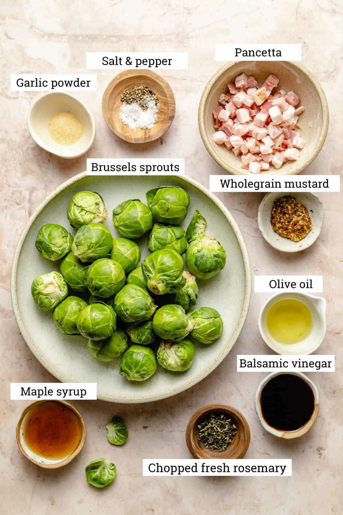 Ingredients for caramelized brussels sprouts including pancetta, wholegrain mustard, balsamic vinegar, maple syrup and spices.