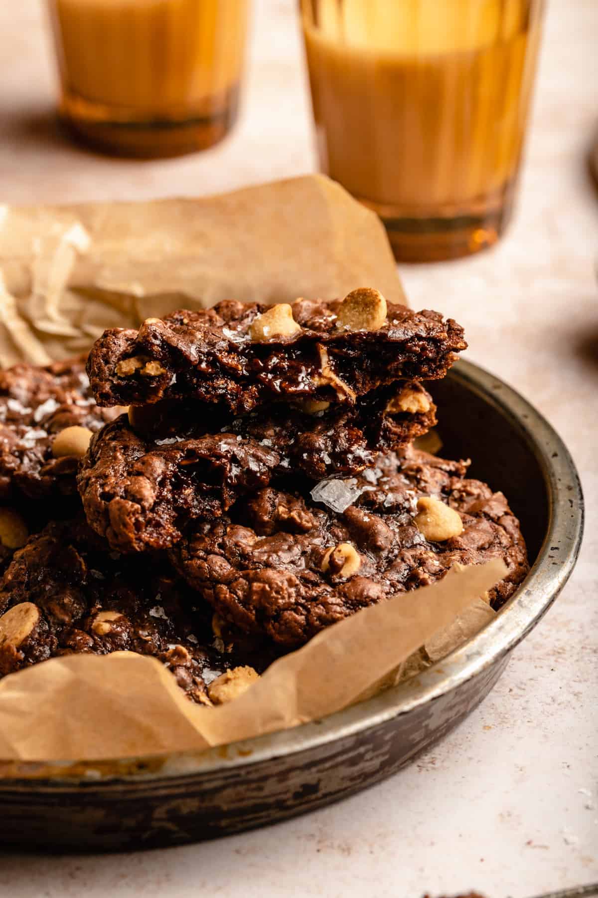 A broken open gooey chocolate peanut butter chip cookie showing the insides.