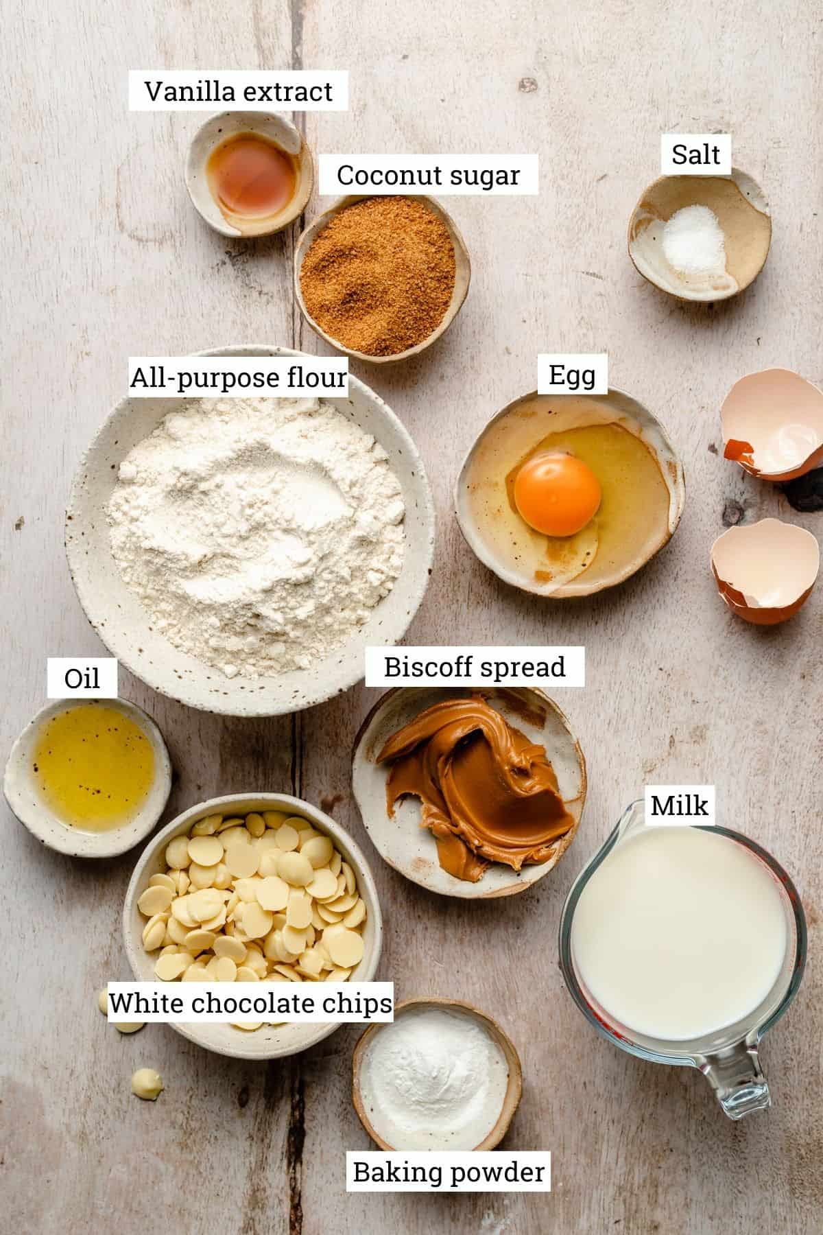 Ingredients required for the cookie spread pancakes in various bowls labelled.