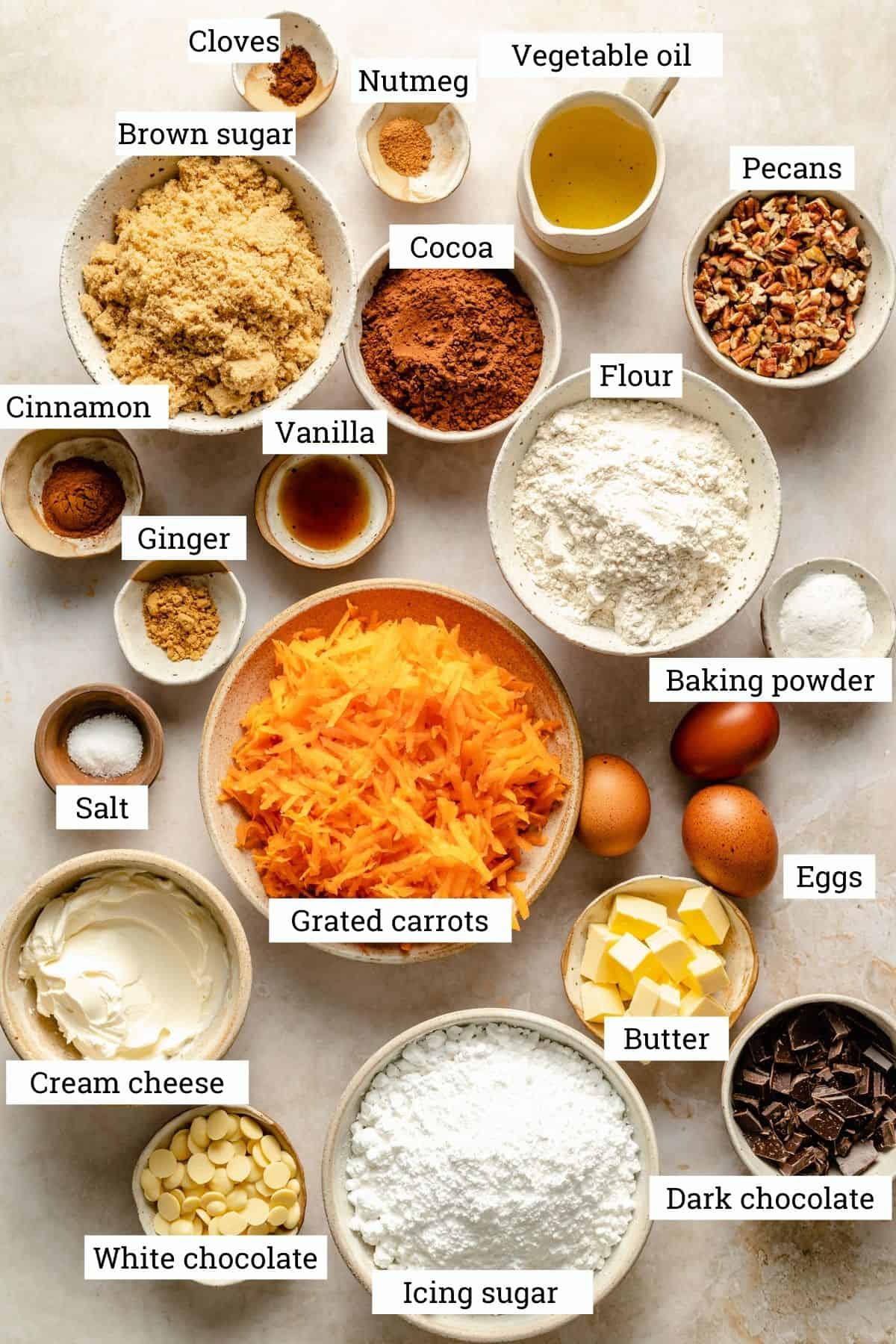 Ingredients in various bowls for the carrot cake. 
