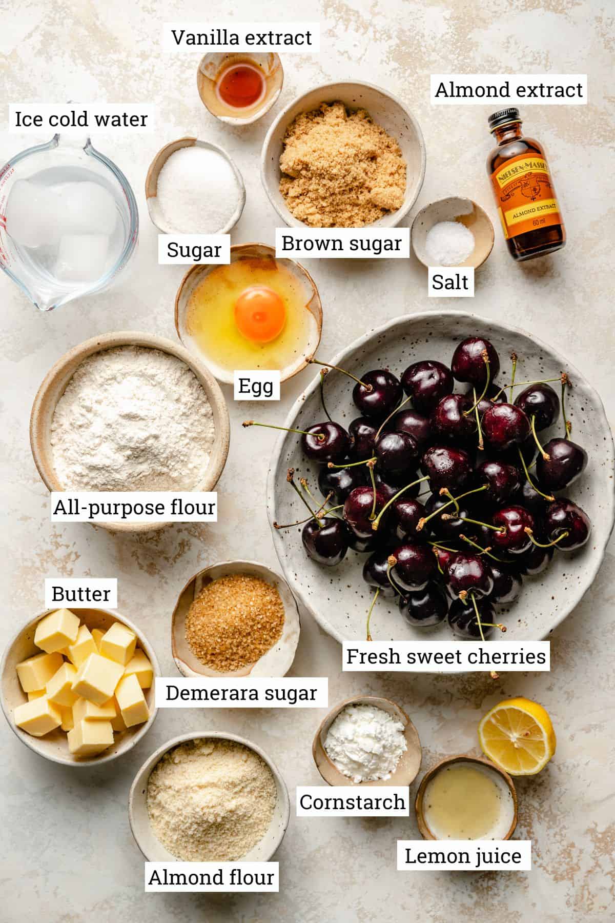 Ingredients in various bowls for the cherry galette recipe.