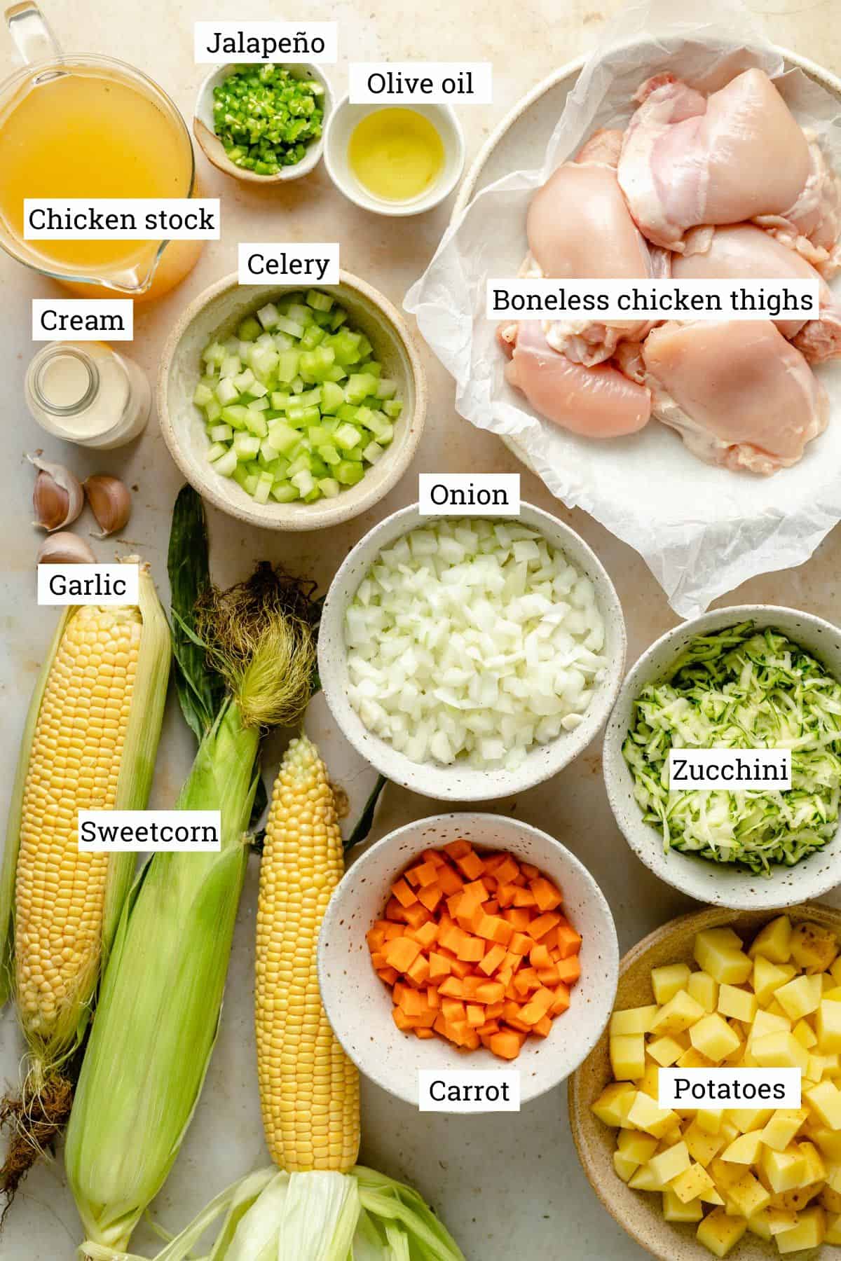 Ingredients in various bowls for a chicken corn chowder.