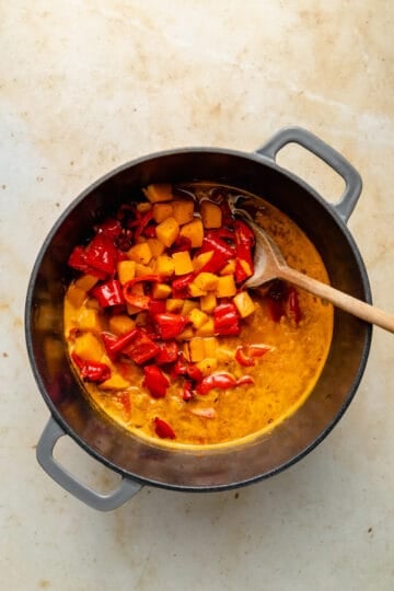 Roasted butternut squash and red pepper added to the soup mixture.