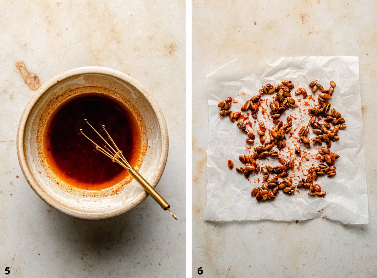 A bowl of dressing with a small whisk and pumpkin seed brittle on parchment. 