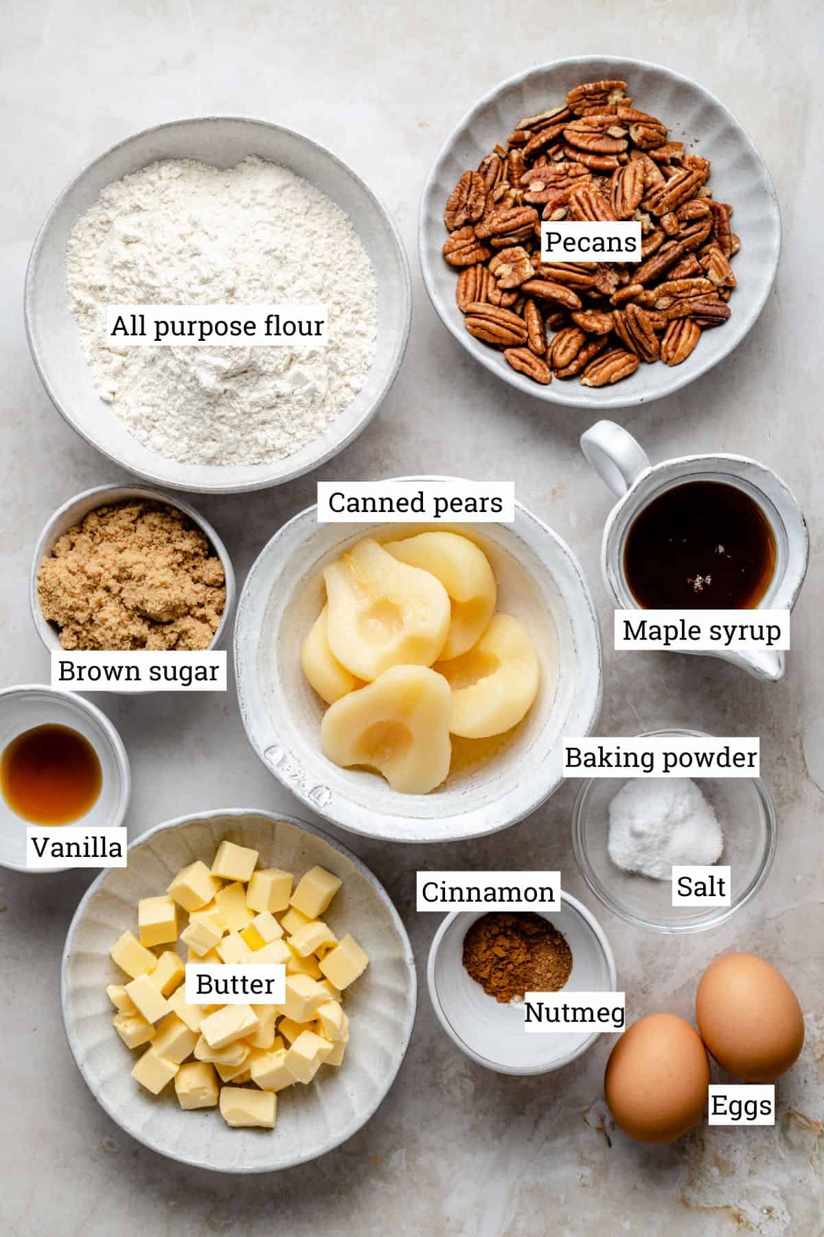 Ingredients in various bowls on a work surface with labels.