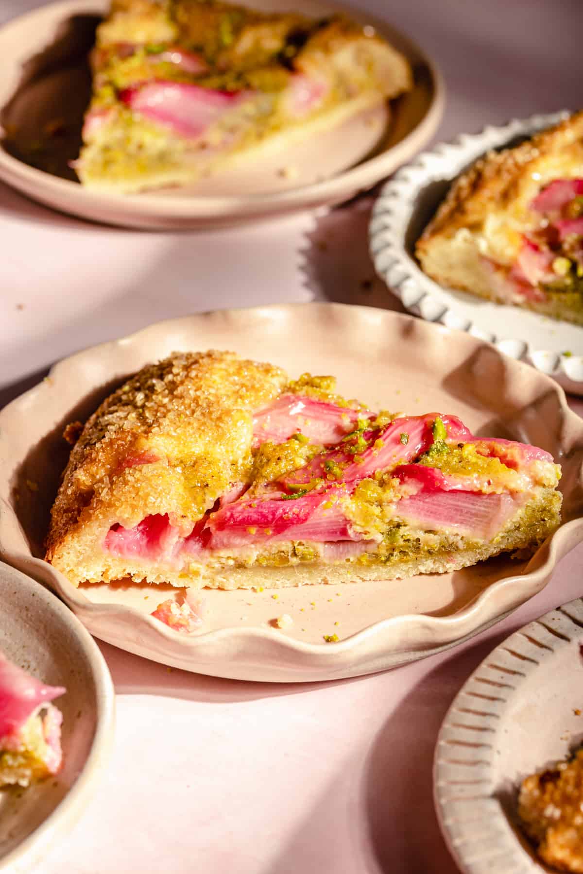 Side of galette showing the filling and frangipane on a plate.