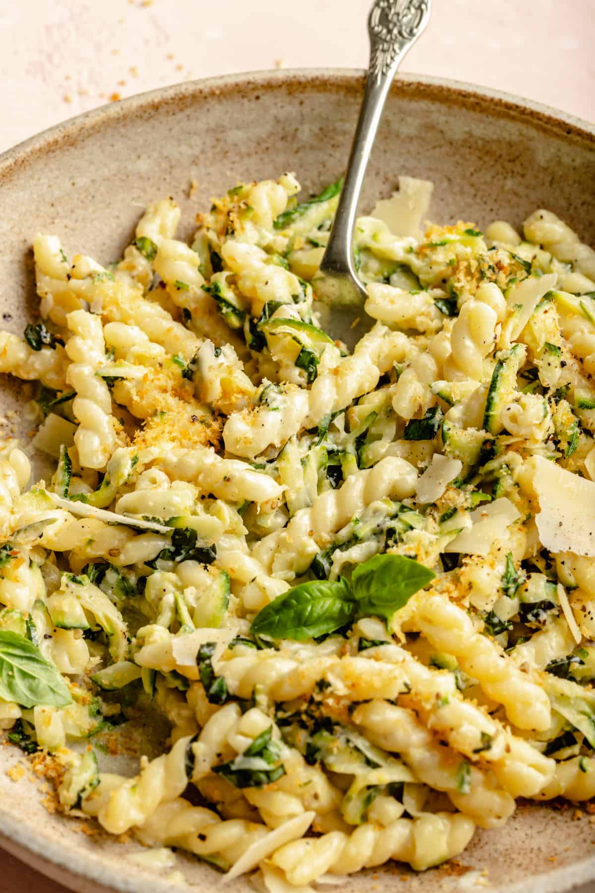 Close up of pasta in a bowl with a fork.